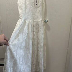 Lacy aqua dress never worn has tags from Bloomingdale’s